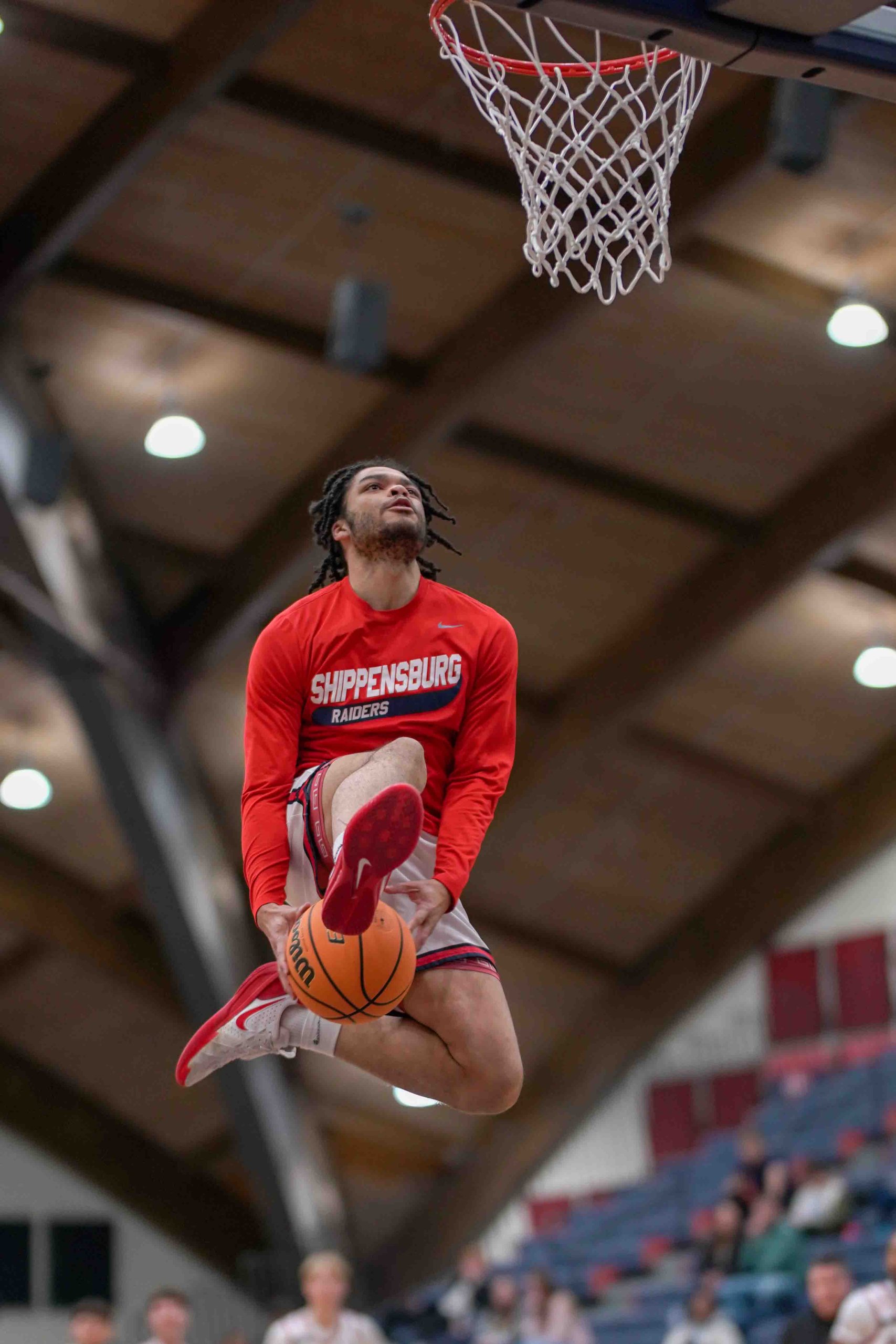 College basketball player in action during a game